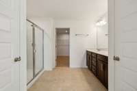 2nd Primary bathroom has double vanity, water closet, linen closet and a large walk in shower.