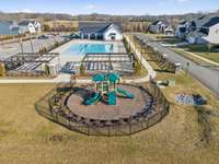 Playground, Farm stands, pool and back of clubhouse. Short walk from this centrally located home in the neighborhood.