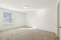 Bedroom 3, also has a walk in closet. Has direct access to a shared bathroom between bedrooms 3 and 4.