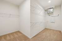 Extra Large closet with plenty of shelving. A filtration system for the home is also in this closet.