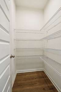 Spacious food pantry opposite Butler's nook between dining room and kitchen