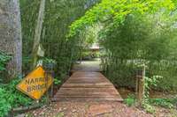 The property has it's own stream with walking bridges to take in the nature - it's like having your own walking trails