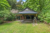 Barn could be a wonderful carport with tons of room for storage