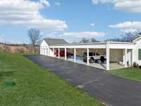 6 covered carport parking spots and 3-car garage