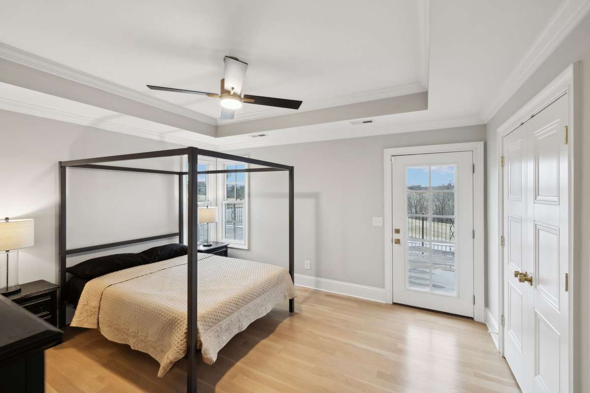 Secondary bedroom upstairs with access to rooftop terrace overlooking the pool.
