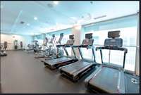 The fitness center is located above the Club area. You can access this gym from the Club area from the steps or just get off the elevator at floor 8 and enter through the double doors. The views are great of the pool area & the glass building vistas!