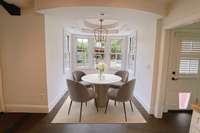 Virtually staged eat-in kitchen nook.