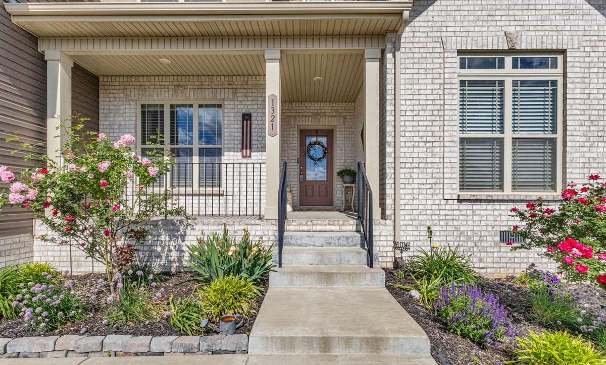 COVERED FRONT PORCH AND MATURE LANDSCAPING