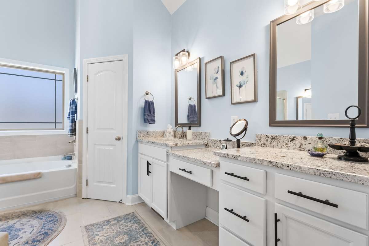 HUGE BATHROOM W/ TALL CEILINGS AND DOUBLE VANITIES