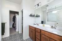 Double vanities and designer chosen tile