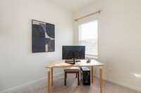 The 3rd bedroom is being used as an office