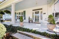 Relax and unwind on this amazing front porch