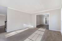 Formal living room leads into separate formal dining room