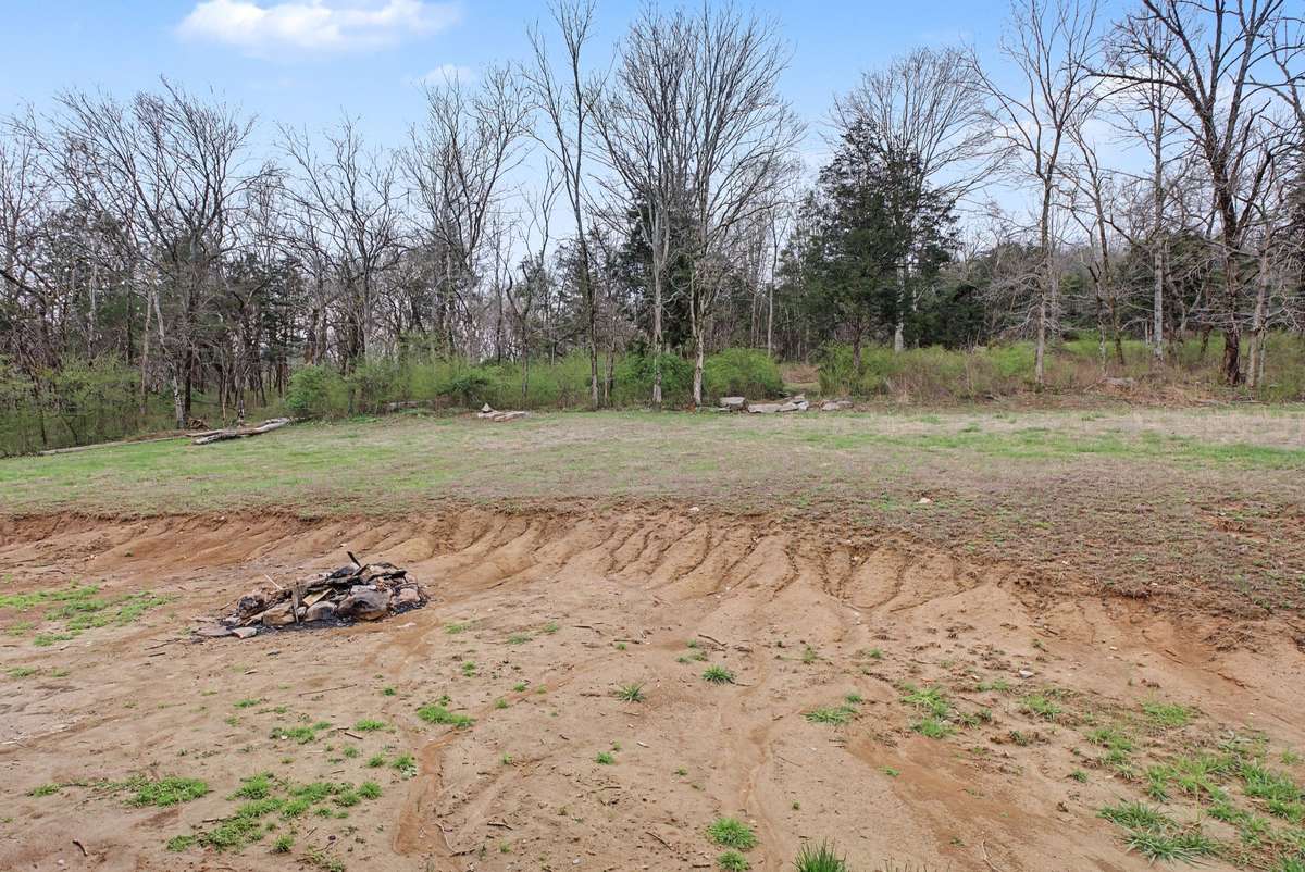Backyard, goes up the hill and is ready to create your dream oasis!