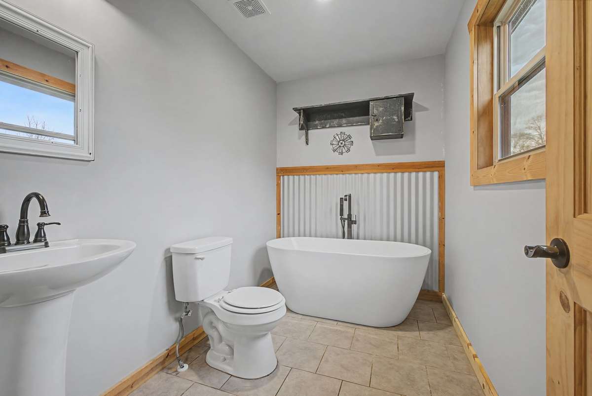 The Primary Washroom features a soaking tub, with shower attachment