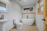 The Primary Washroom features a soaking tub, with shower attachment