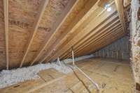 Ample walk in storage space off the the loft