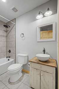 The guest bath features a vessel sink
