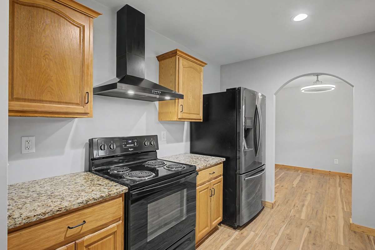 Sleek, matching appliances convey with the sale