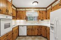 The cozy kitchen features a classic three point work area.