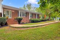 Welcoming front porch with a bay window from your kitchen