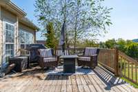 Maturing trees border the deck.