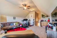 Ceiling fan in bonus room.