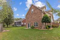 Large side yard with access to lower level.