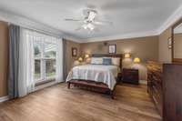 Spacious Primary Bedroom on main level with new LVP flooring.