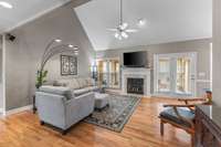 Vaulted Great Room with  Hardwood floors and Gas Fireplace.