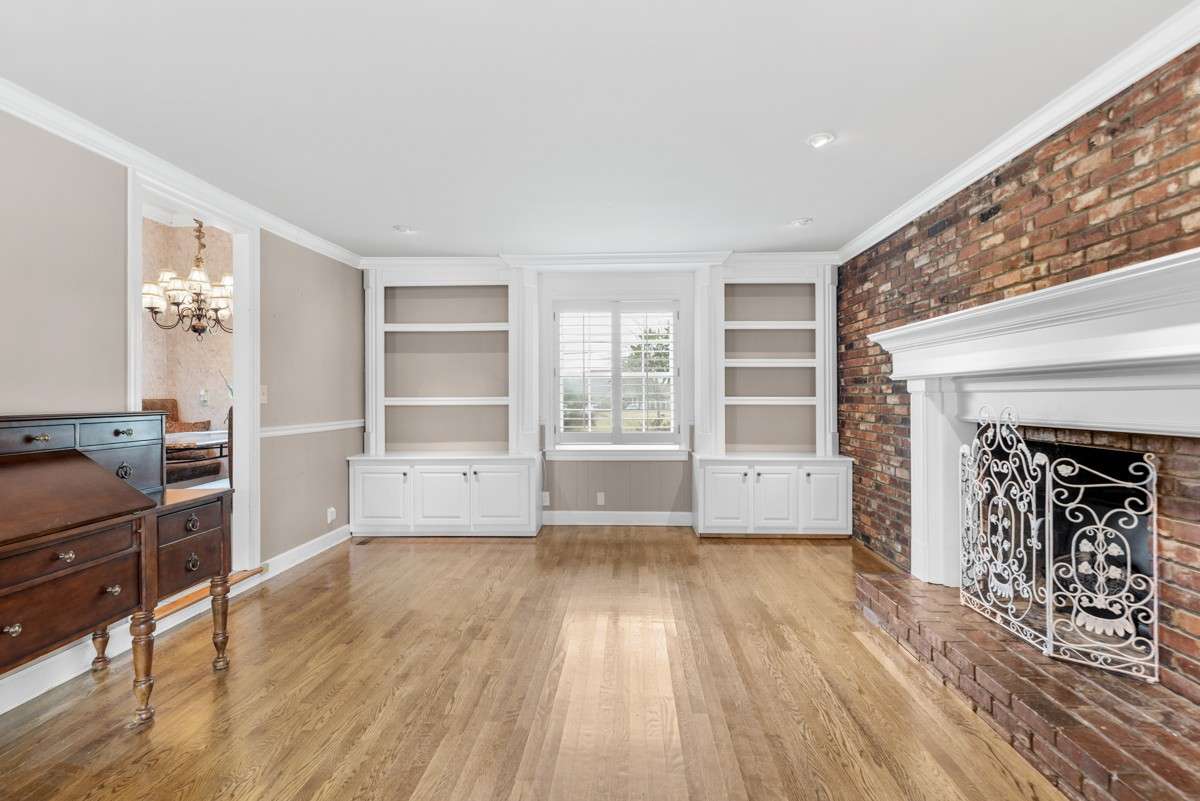 Custom Built Cabinetry w/ Shelving and storage lends an air of "Office"- a good place to 
 lounge