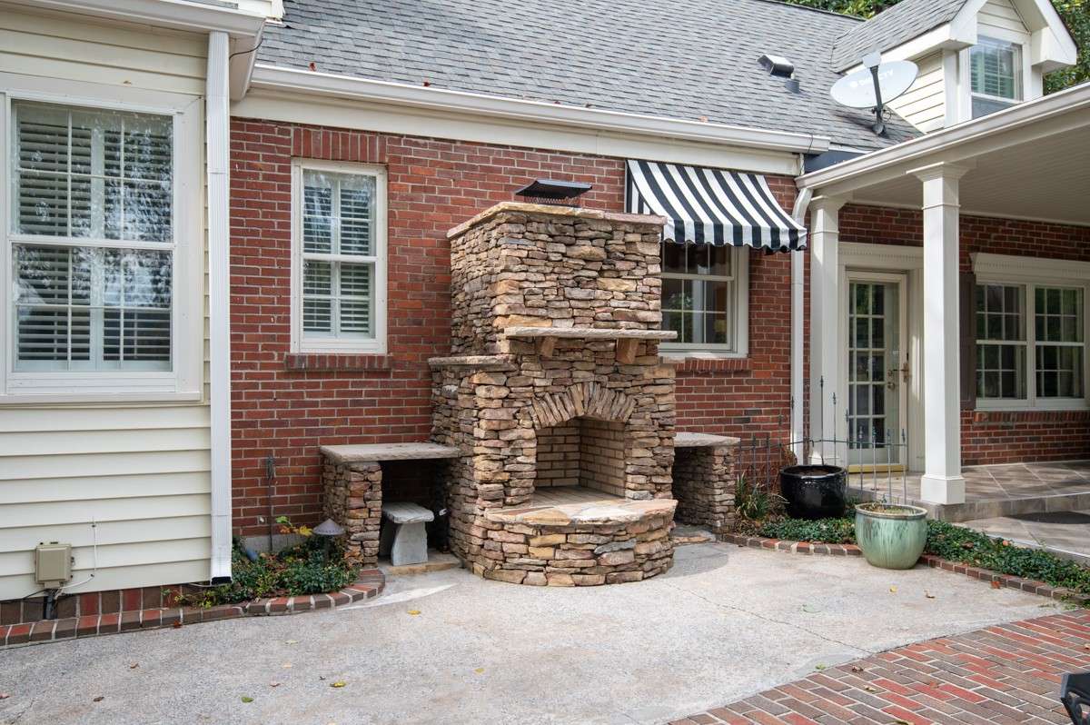 Stacked Stone Fireplace, rarely used but just the Ticket for Entertaining- a Blend of Brick , stone, Tile compliments the Outdoor arena