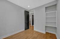 This bedroom has built in's that would make it the perfect home office.