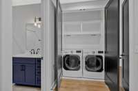 The laundry room is conveniently located upstairs.  The high end washer and dryer convey with home!