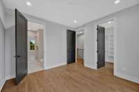 The primary bedroom has a large walk-in closet and spacious bathroom.