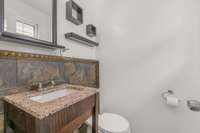 Half bathroom located inside the rear facing bedroom..