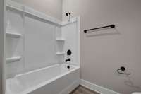 Example of the  first floor guest bath from the same floorplan under construction down the street. See the color pallets on coming photos for the colors chosen for this home.