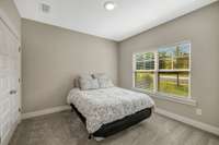 Secondary bedroom with large closet. Could be used as an office front of house.