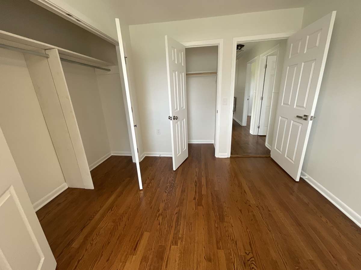 Second bedroom with not one, not two but three closets.