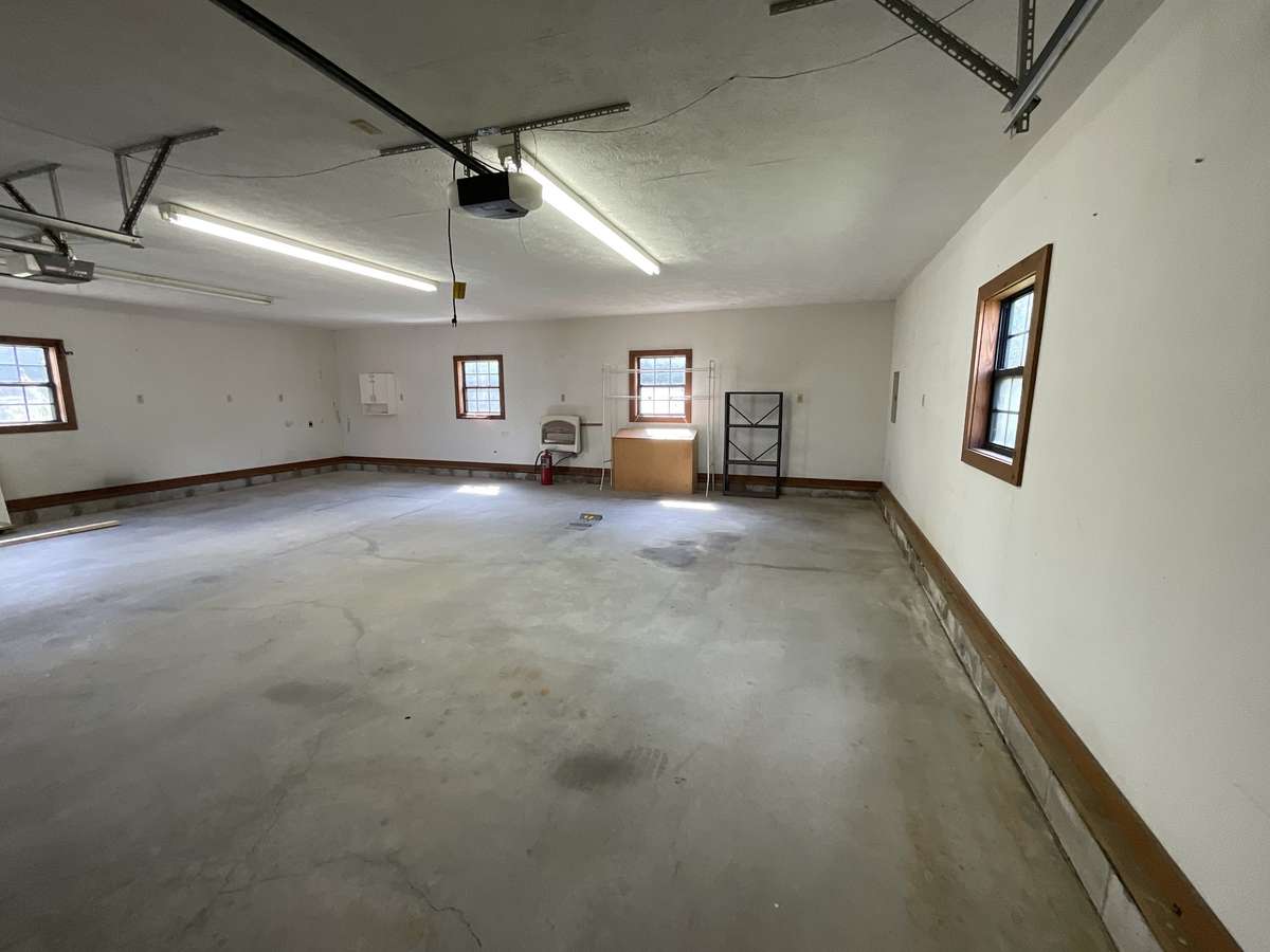 Concrete floor, a two electric garage doors openers. Home conveys with two propane tanks one for the shop and one for the house.