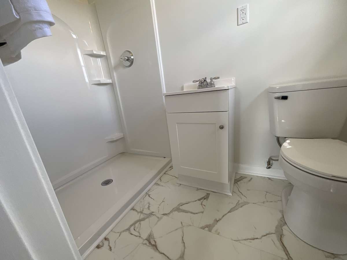 Primary bathroom with step in shower.