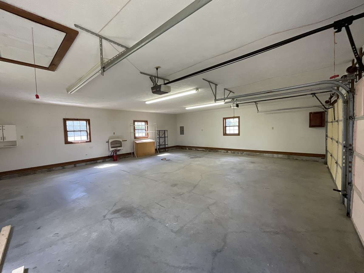 Can we say garage? Look at all that work space. It’s heated so you can enjoy it this winter.
It can be the perfect spot when your in the “doghouse”.