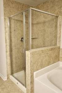 Separate shower and tub in the primary bathroom.