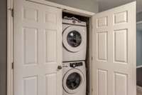 The laundry room has lots of storage.