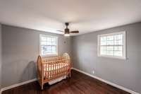 Bedroom #3 features lots of natural light and beautiful hardwood floors.