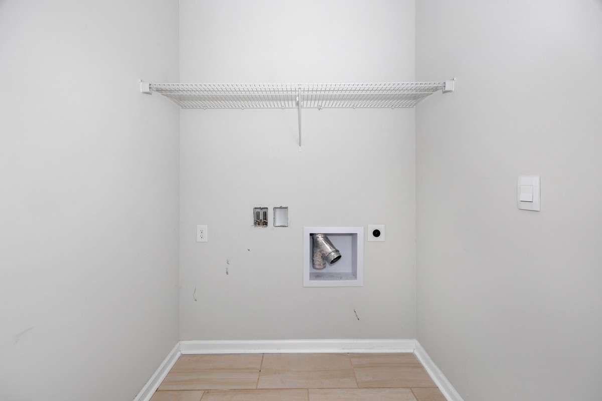 Laundry Room- washer/dryer connections, wire shelving