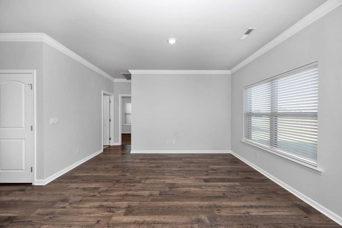 Living Room- Lvp flooring, crown molding, recessed lighting, open floorplan