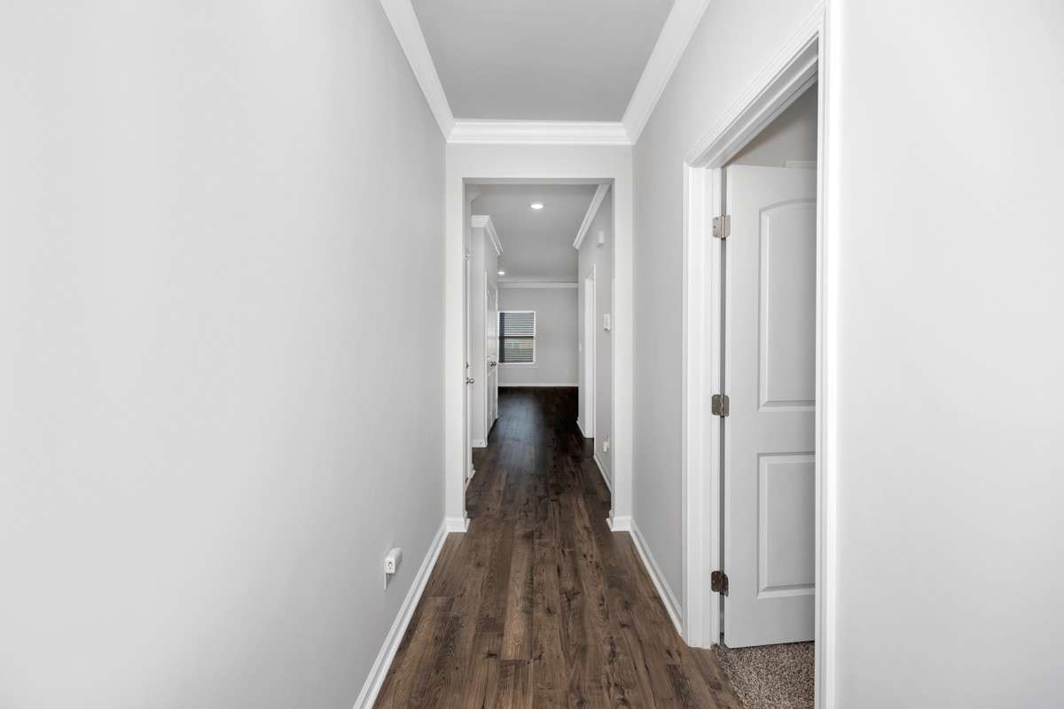 Hallway- lvp flooring, crown molding