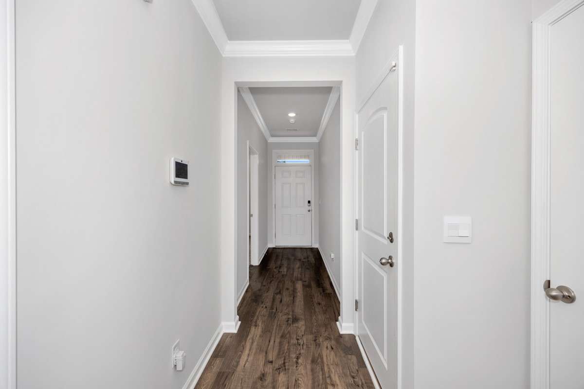 Hallway- lvp flooring, crown molding