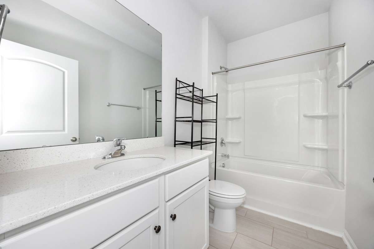 Full Bath- tile flooring, tub/shower combo